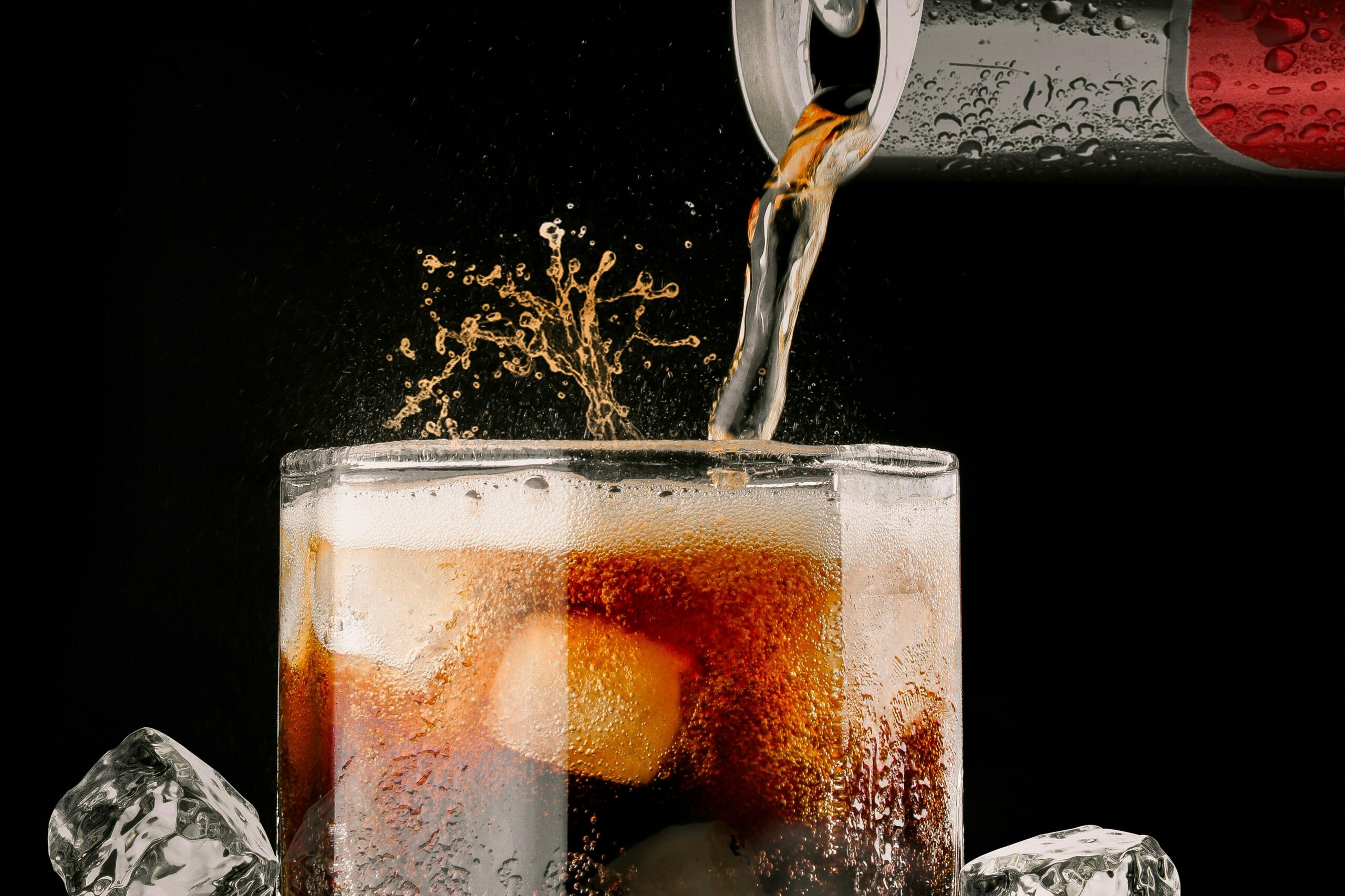 pop being poured in glass